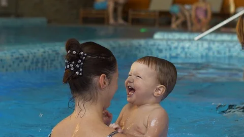 Laughing boy with mother in the pool Stock Footage 125072610