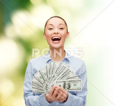 Laughing businesswoman with dollar cash money Stock-Fotos