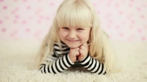 Laughing child looking at camera Stock Footage 8986268