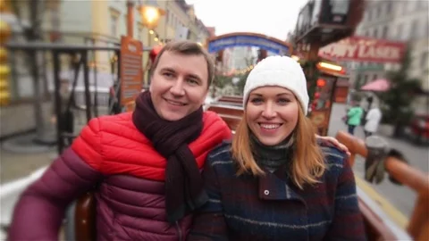 Laughing Couple Having Fun in the Attraction on the Christmas Market, Young Stock Footage 70127789