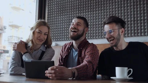 Laughing at a funny content, group of young adults Stock Footage 106093417