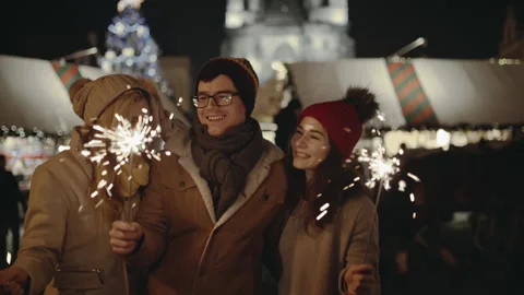 Laughing group of friends having fun at the Christmas Fair. People lighting Stock Footage 139656740