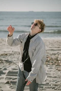 Laughing guy on the beach Stock Photos