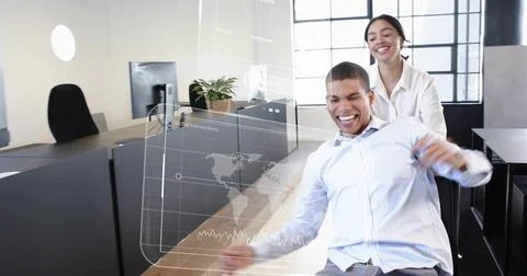 Laughing man in light button-up leaning back on rolling chair at office, data Stock Photos