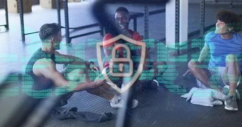 Laughing men projecting binary lock shield overlay at gym while sitting on mats, Stock Photos