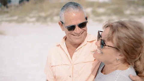 Laughing Middle-Aged Man and Woman at the Beach Stock Footage 86478262
