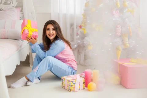Laughing model sitting on the floor Stock Photos