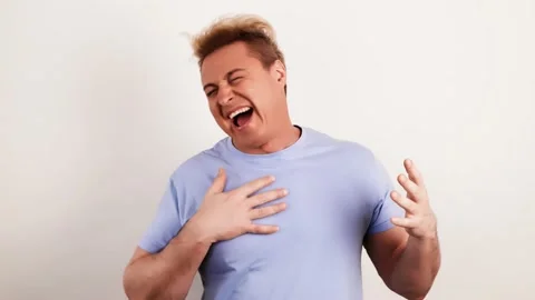 Laughing overjoyed man looking at camera. Smiling excited guy Stock Footage 234531530