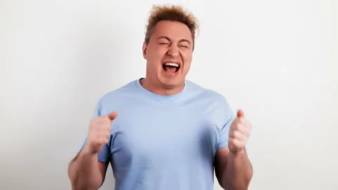 Laughing overjoyed man looking at camera. Smiling excited guy Stock Footage 235367387