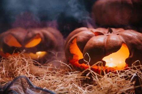 Laughing pumpkins with a candle inside Stock Photos