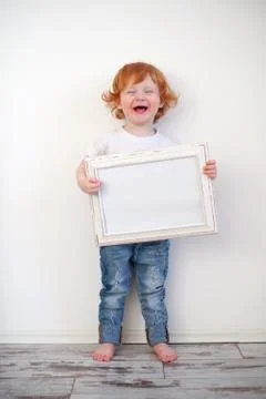 Laughing redhead boy Stock Photos