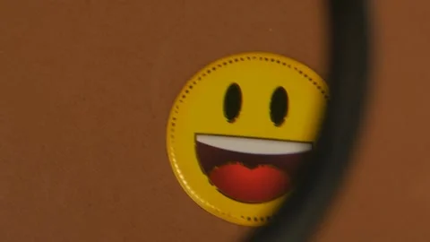 Laughing Smiley Face Under Magnifying Glass Stock Footage 303267982