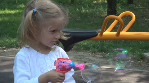 Laughing, Smiling Child Playing with Soap Bubbles at Playground, Children Stock Footage 11285530
