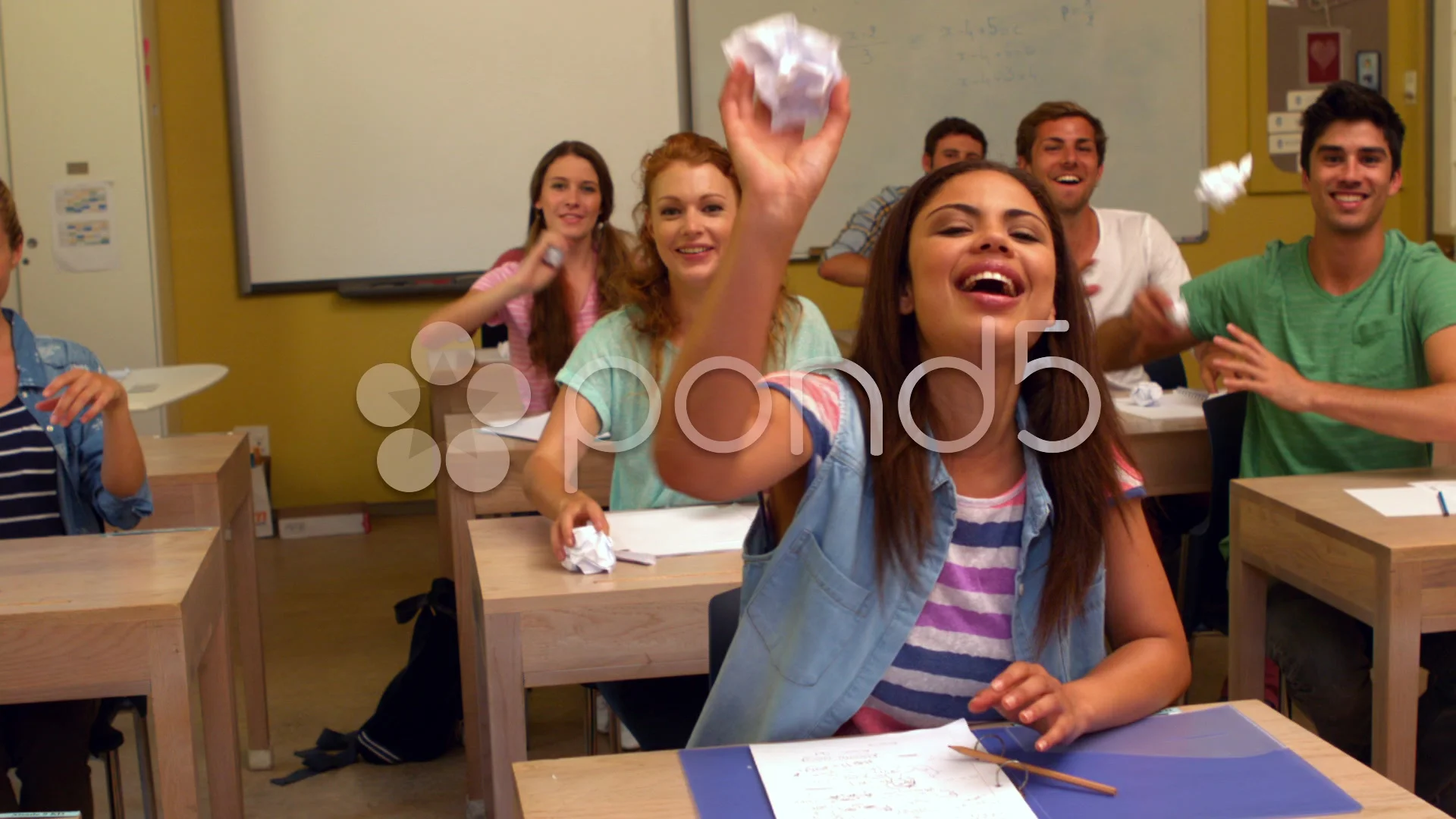 student throwing desk