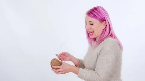 Laughing when having a coconut in her hands Stock Footage 83724547