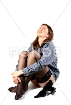 Laughing young woman in shirt and black stockings. Stock Photos