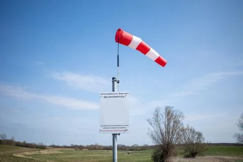 On  launch site for ballooning there is a wind vane and the sky is blue Stock Photos