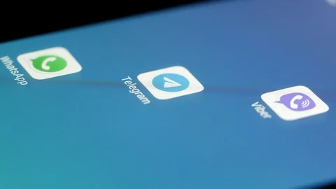 Launch of Telegram application. Someone is touching smartphone screen by finger 스톡 동영상 120840651