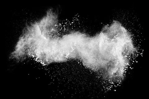 Launched white powder splash on black background. Stock Photos