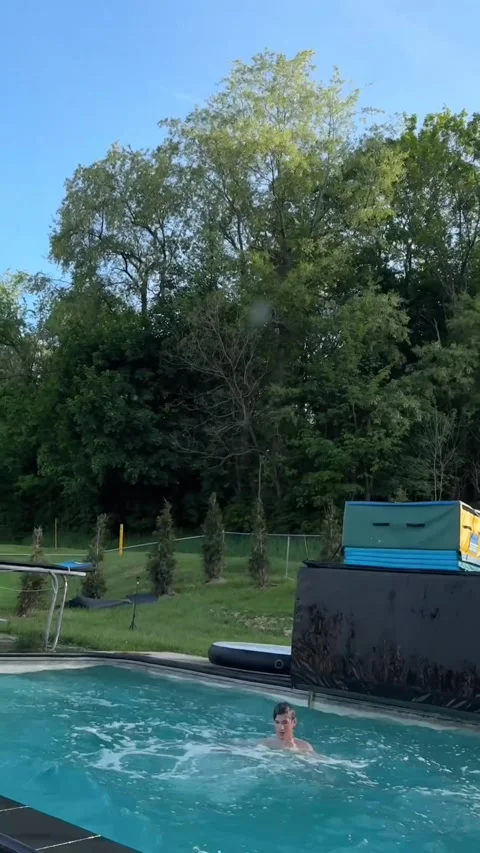 Launching a Ball by Jumping in a Pool, Hempfield township, Pennsylvania, USA - 1 Stock Footage 340239012