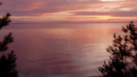 Launching off From Coast Dramatic Aerial over Great Lakes with Colorful Sunset Stock Footage 137657175