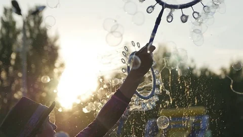 Launching a Large Number of Soap Bubbles Stock Footage 110775125