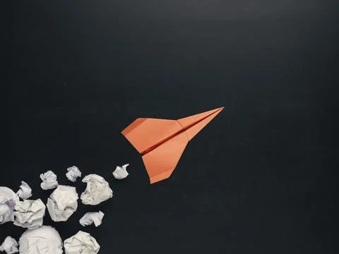 Launching paper rocket with jet stream of paper balls, creativity concept or new Foto stock
