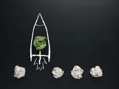 Launching rocket with paper balls, creativity concept or new ideas metaphor, Foto stock
