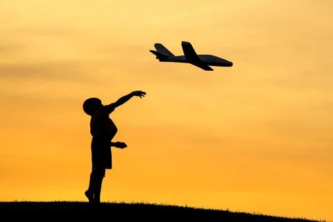 Launching a toy plane. Stock Photos
