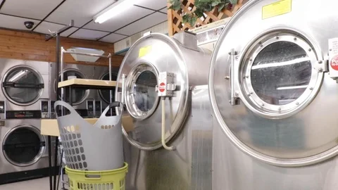 Laundromat agitating washers Stock Footage 102019991