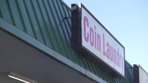 Laundromat coin laundry sign Stock Footage 166331342