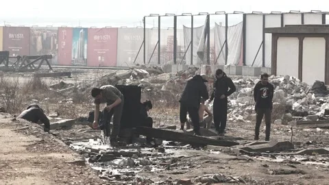 Laundry and shaving at a refugee camp Stock Footage 181983666