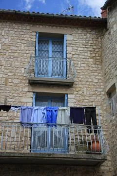 Laundry on a balcony Stock Photos