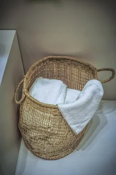 A Laundry Basket on the floor Stock Photos