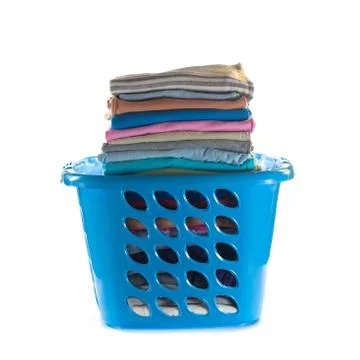 Laundry basket with folded clothes Stock Photos