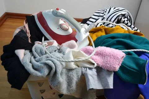 A laundry basket full of clothes Stock Photos