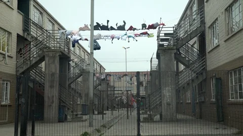Laundry Blowing on a Line Between Buildings co Stock Footage 116741064
