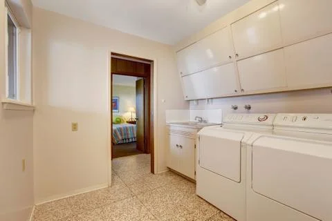 Laundry with built in cabinets Stock Photos