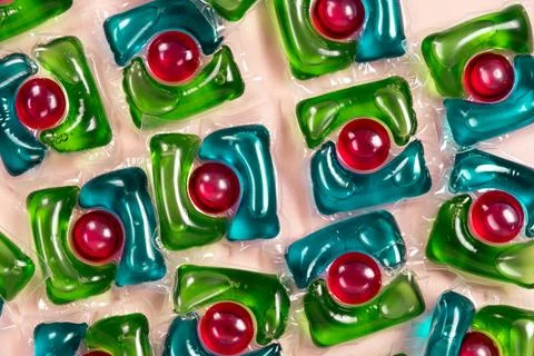 Laundry capsules on beige background close-up Foto stock