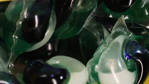 Laundry capsules for washing machine close-up. capsule contains concentrated Stock Footage 269452636