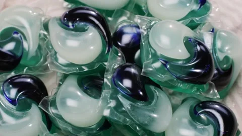 Laundry capsules for washing machine close-up. capsule contains concentrated Stock Footage 270479375