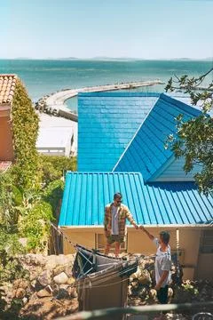 Laundry, clothes and support with men in outdoor for sunshine, linen and success Stock Photos