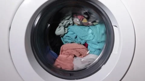 Laundry, clothes are washed in the drum of a washing machine Stock Footage 262145561