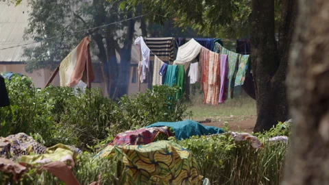 Laundry / Clothes drying near a fire in Africa, Cameroon Stock Footage 258269769