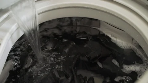 Laundry clothes in top loading washing machine Stock-Footage 119697329