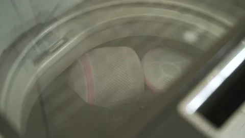 Laundry clothes in top loading washing machine Video stock 139027070