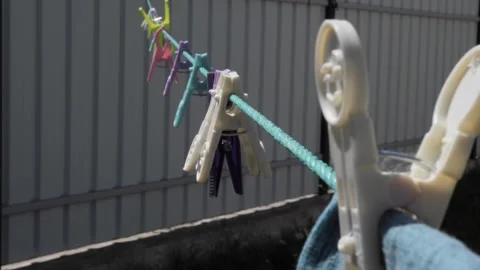 Laundry clothespins attached to the laundry rope outdoors Vidéo 292444113
