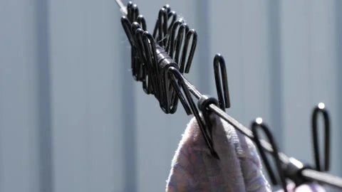 Laundry clothespins attached to the laundry rope outdoors Stock-Footage 292552751