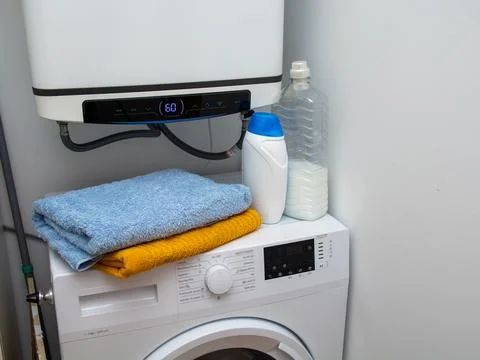 Laundry corner with washing machine and towels Stock Photos