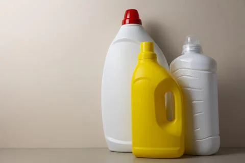 Laundry detergent bottles on color background, household cleaning concept Fotos de archivo